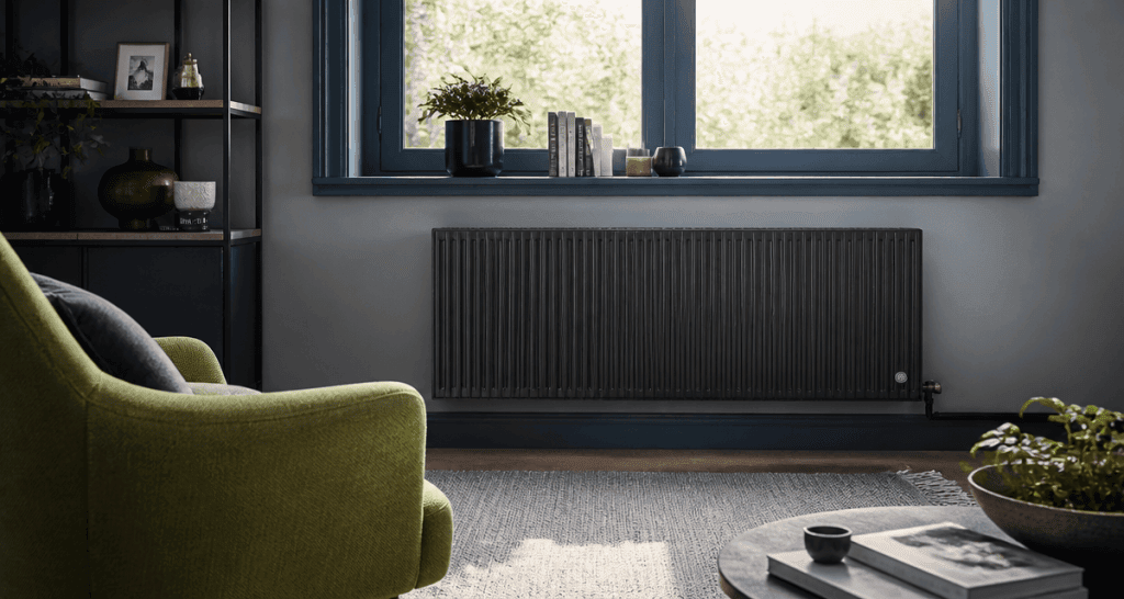 radiateur à inertie comparatif fonte anthracite sous fenêtre